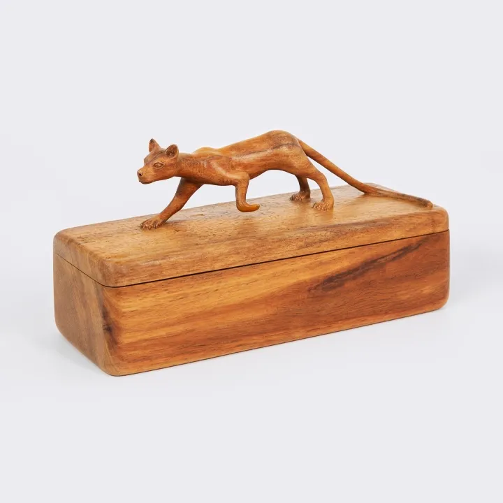 Handcrafted wooden jewelry box with carved animal sculpture on lid, artisanal home decor in natural wood.