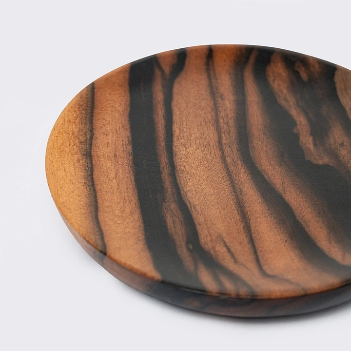 Rotating view highlighting the round coaster's features.