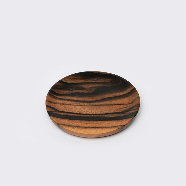 Rotating view highlighting the round coaster's features.